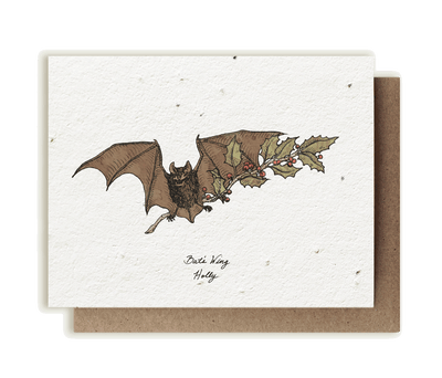 A photo of a plantable seed card with our original illustration of a branch of holly (genus Ilex) and a bat